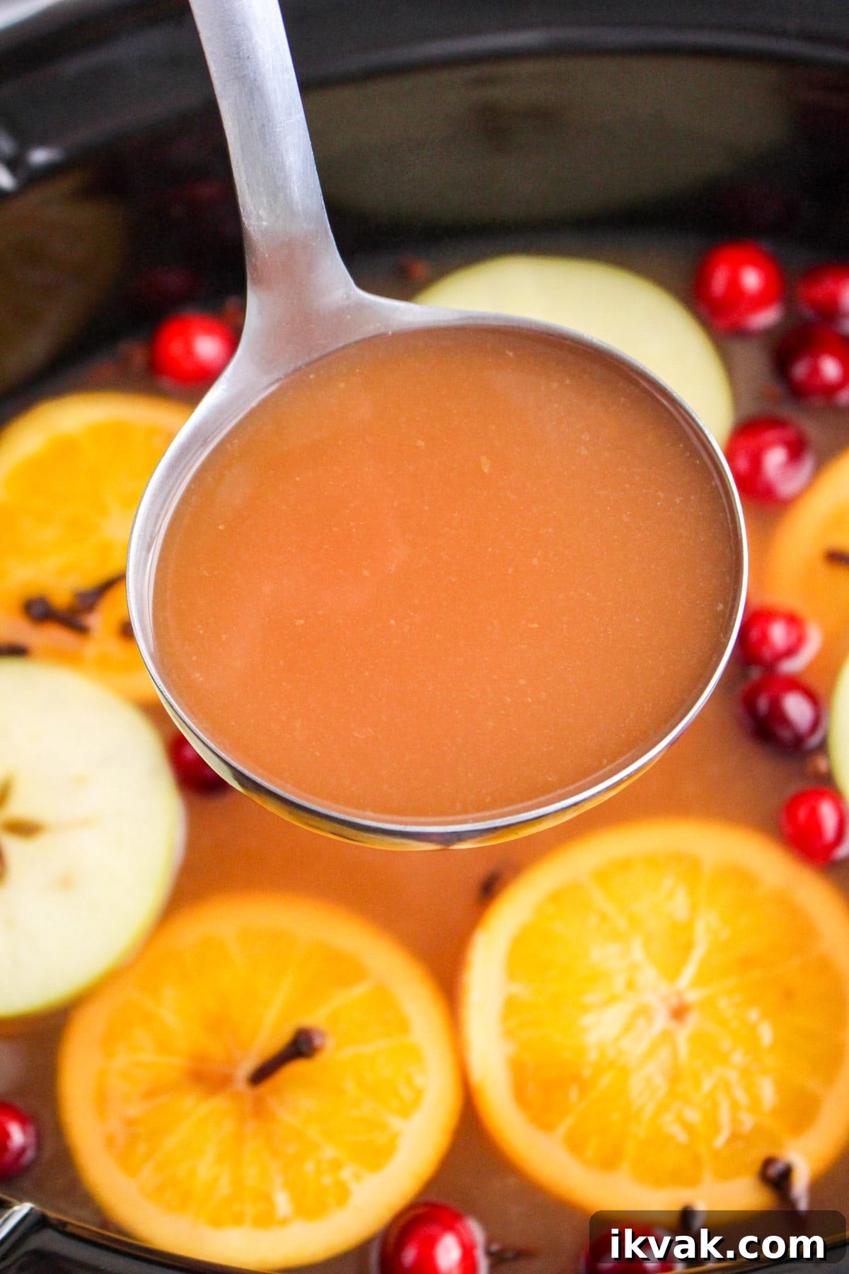wassail in metal ladle