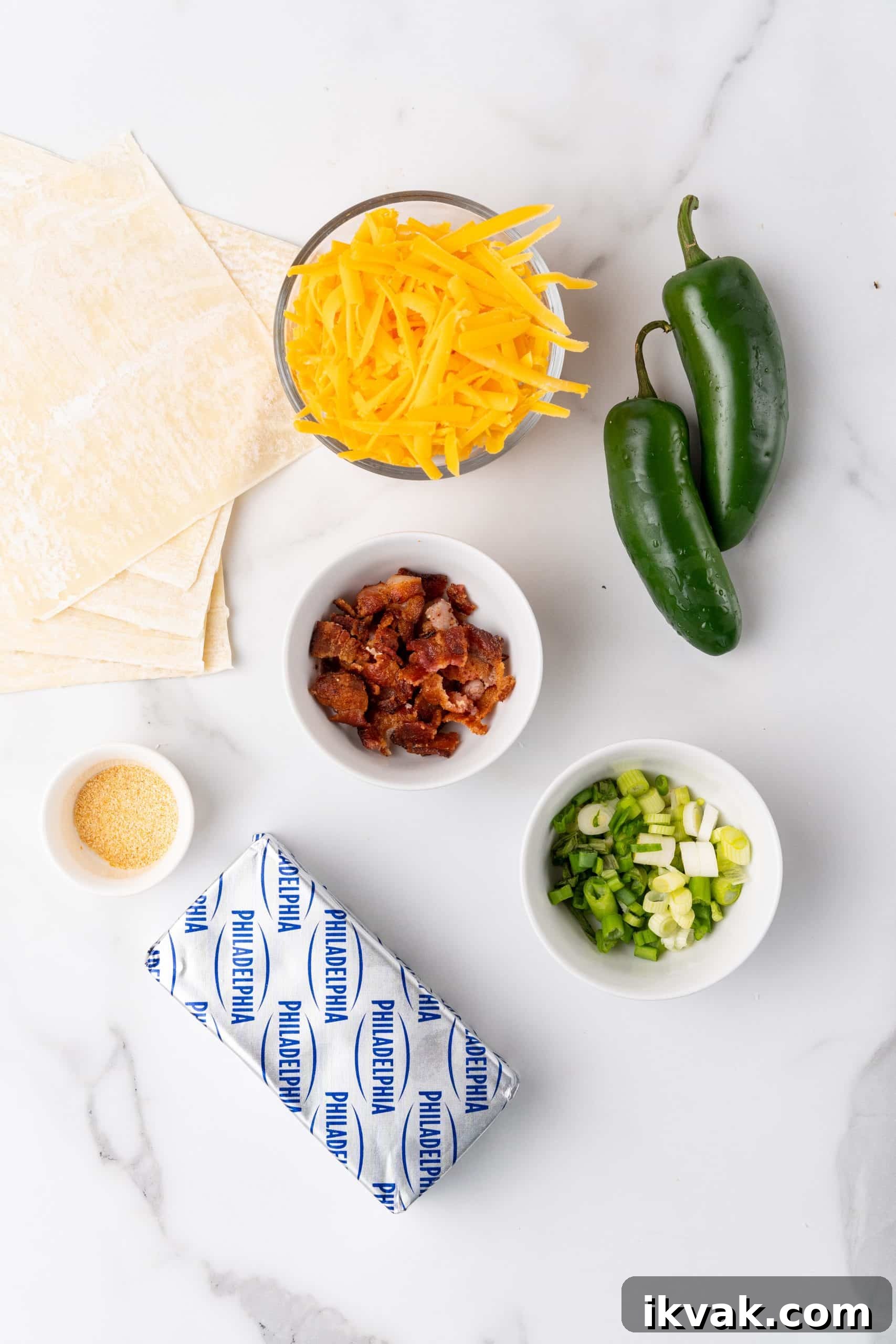 Jalapeño Popper Egg Rolls Recipe — Crispy Stuffed Jalapeño Rolls 4 overhead image showing the measured ingredients needed to make a batch of jalapeno popper egg rolls