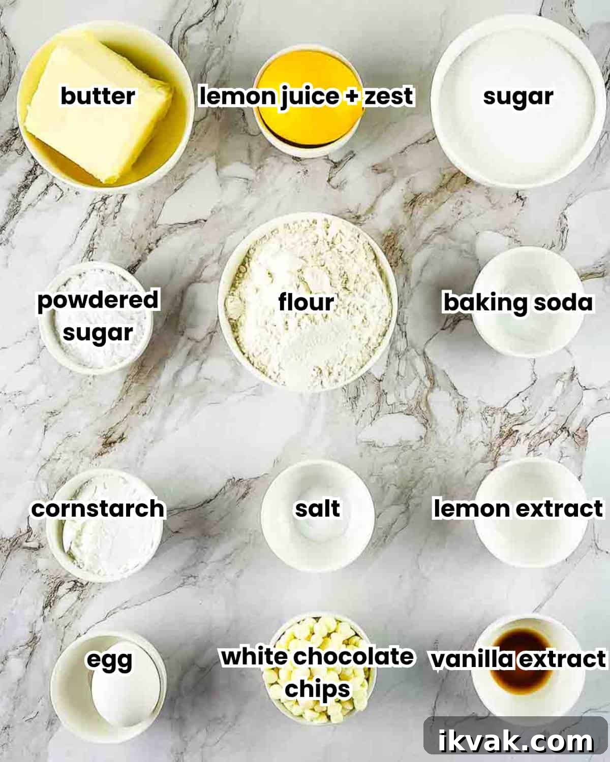 Lemon Drop Cookies Recipe: Soft, Chewy Cookies Like Panera 3 A photo showing the labeled ingredients for lemon drop cookies measured out on a white counter.