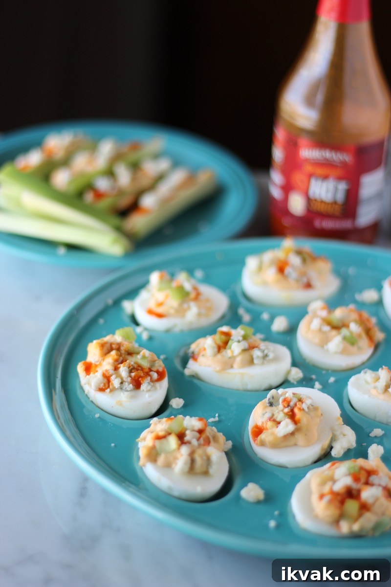 Spicy Buffalo Deviled Eggs with Blue Cheese 13 Buffalo Deviled Eggs - celery, blue cheese, and hot sauce take deviled eggs up a notch! So easy to make and super yummy! | fedandfulfilled.com