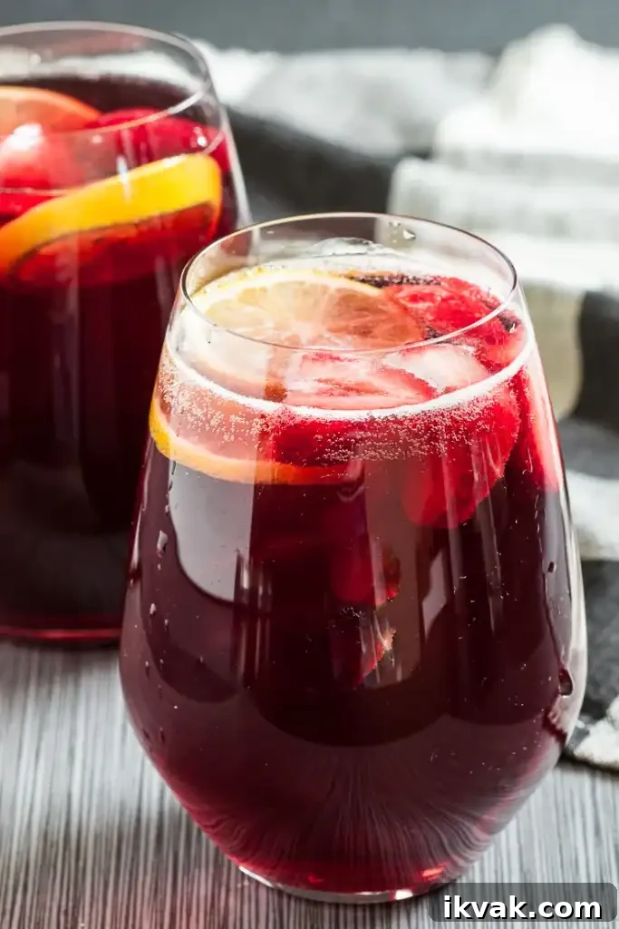 A glass of Halloween berry champagne punch.