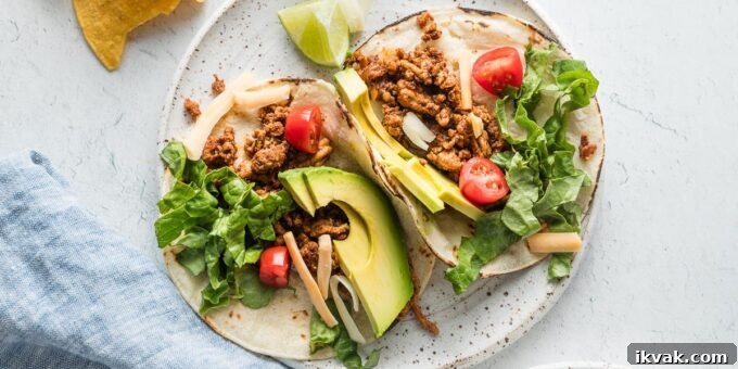 Ground chicken tacos served with toppings, quick and easy for a weeknight meal.
