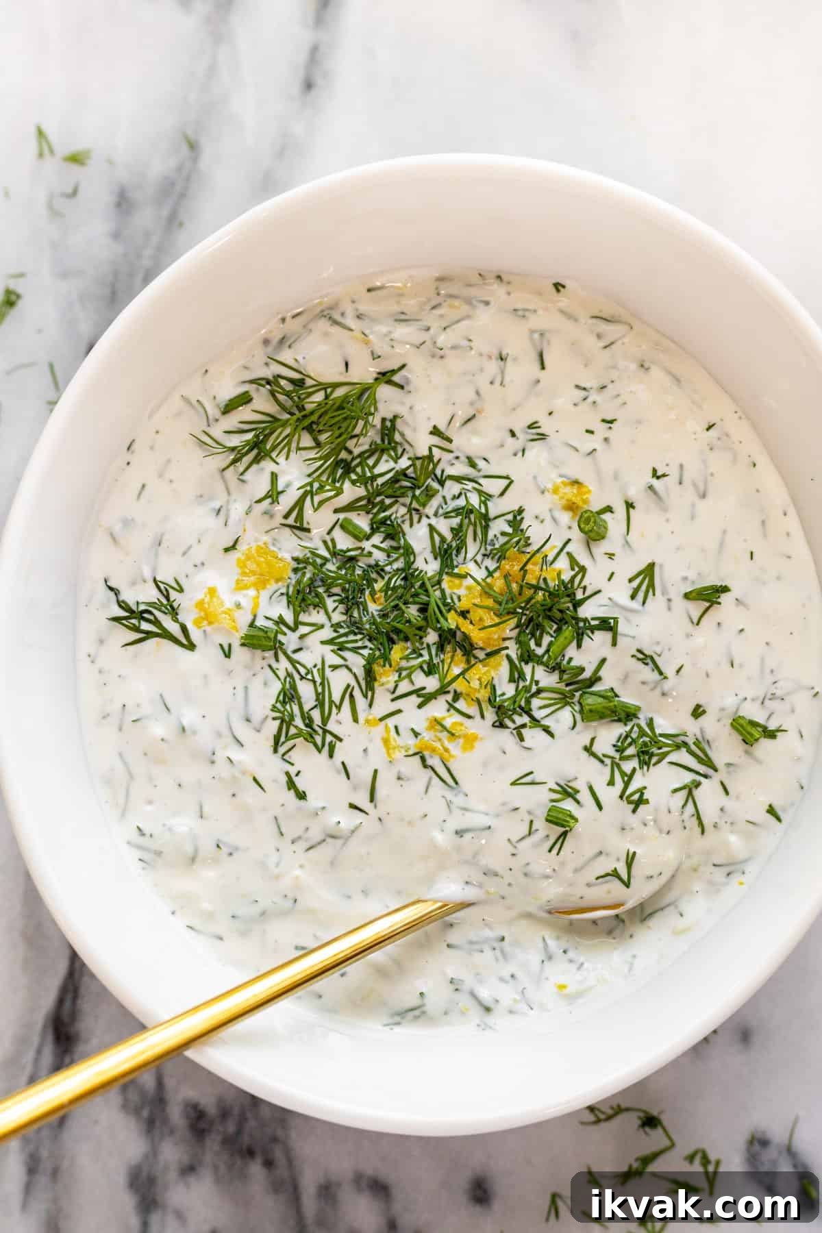 Creamy Dill Sauce for Salmon in 5 Minutes 4 White bowl filled with creamy lemon dill sauce for salmon.