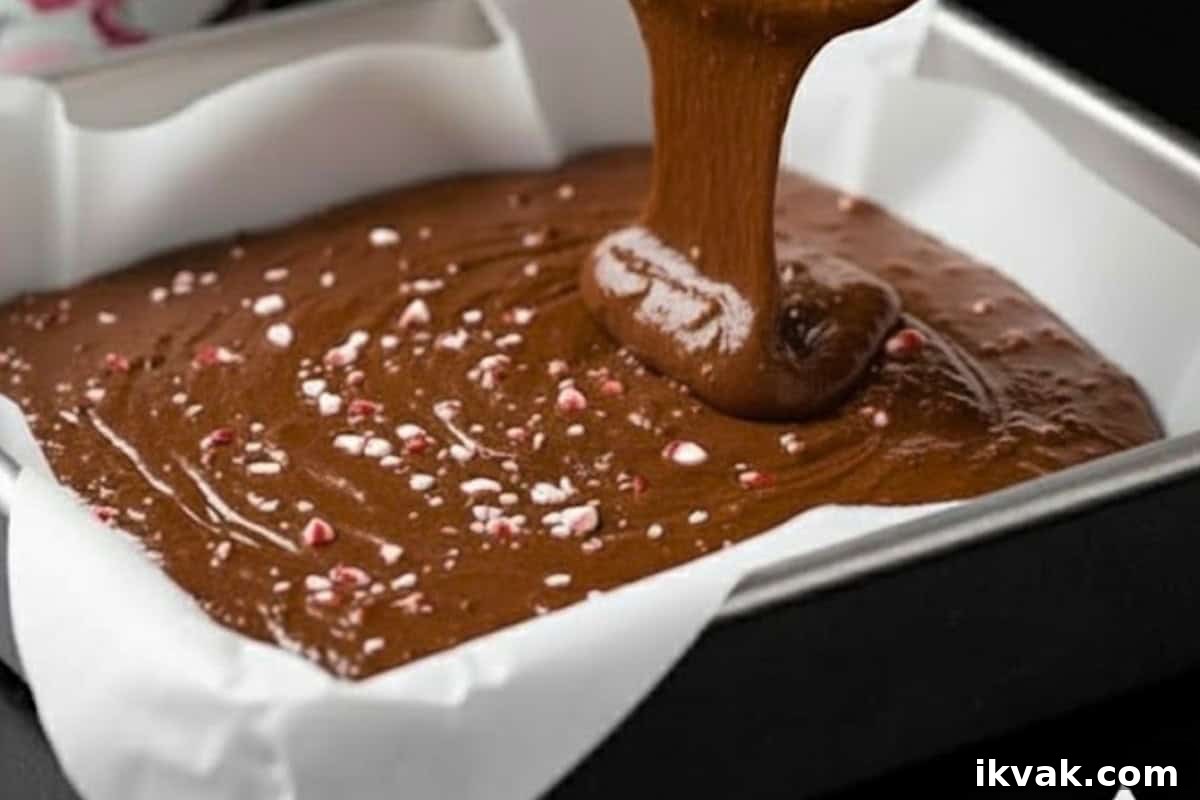 Pour the batter into the prepared pan, smoothing out the top