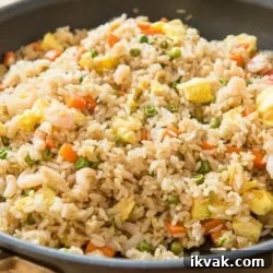 Fried Rice In a Nonstick Skillet with Egg, Carrots, and Peas