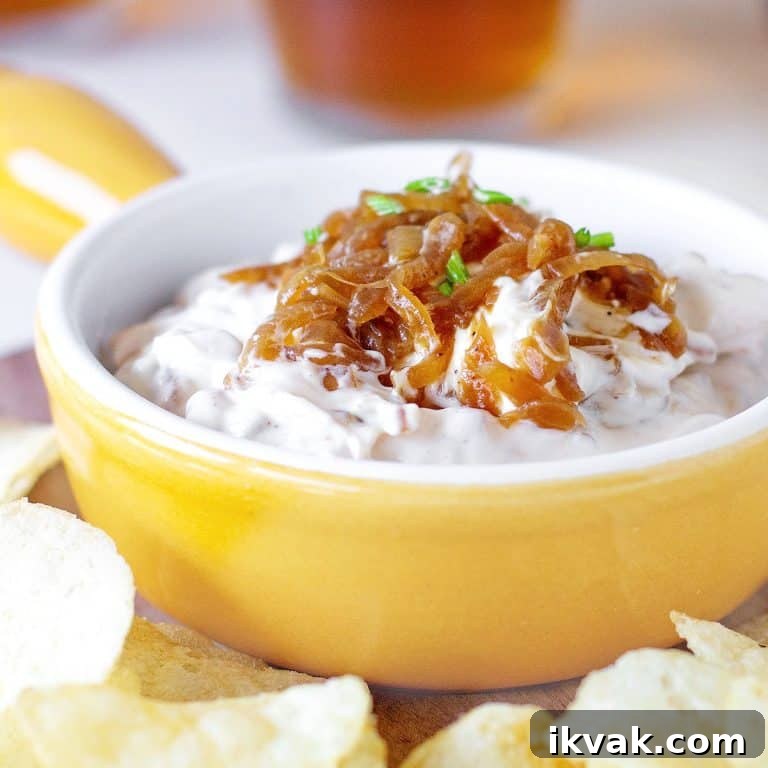 Yellow shallow ramekin with caramelized Onion Dip surrounded by potato chips