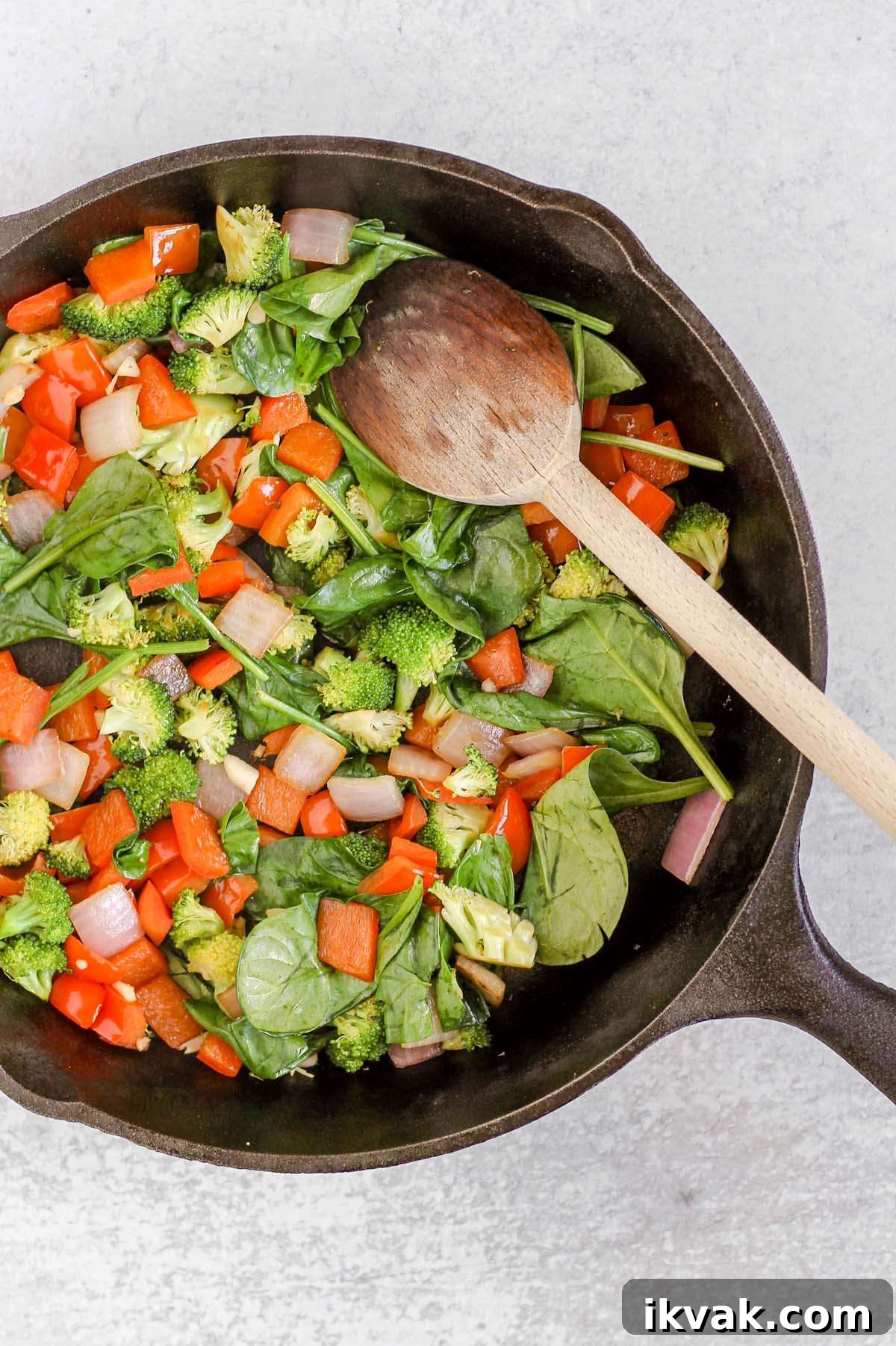 Dairy-Free Vegetable Frittata Gluten-Free Breakfast Recipe 4 Sautéed vegetables in a cast iron skillet.