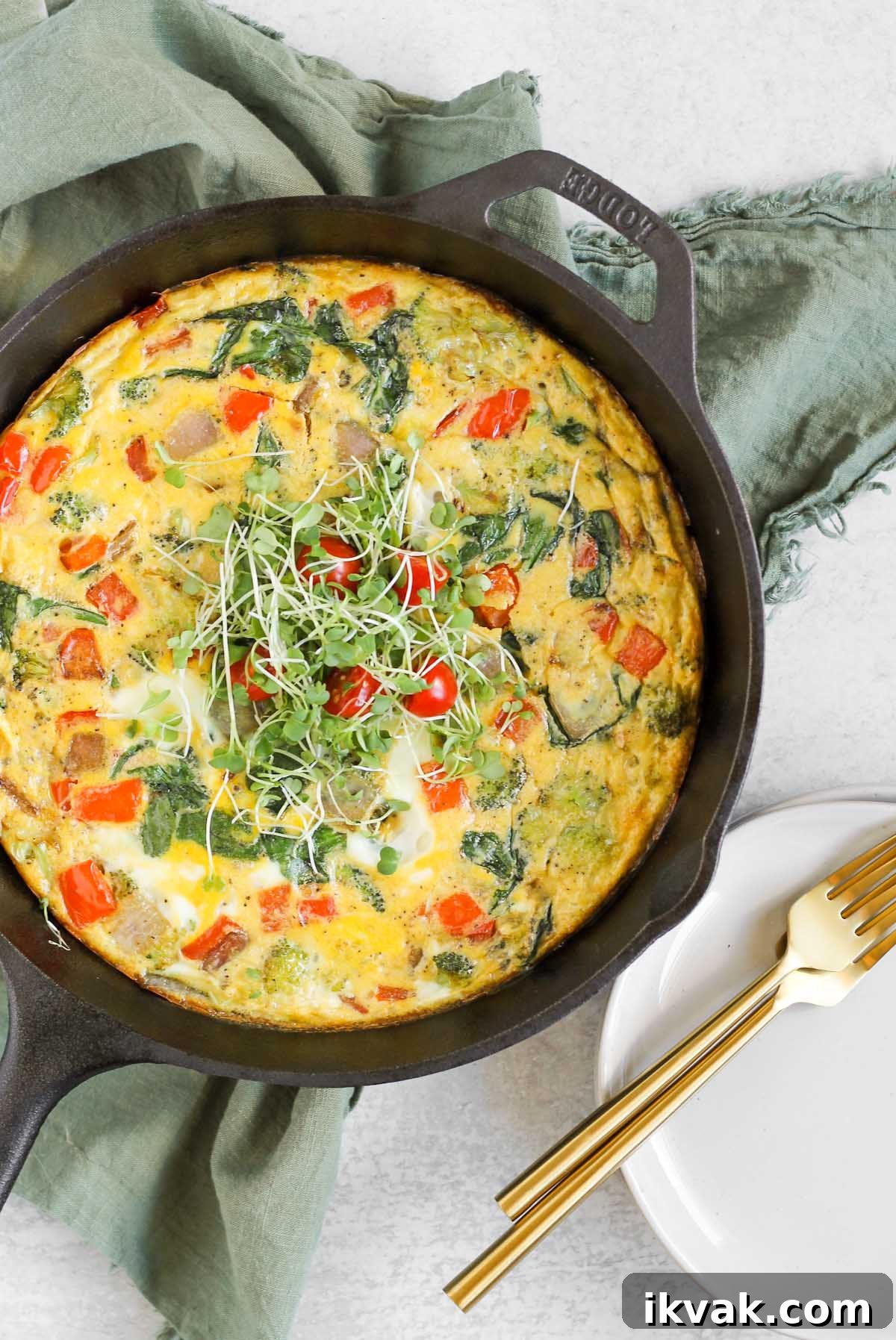 Dairy-Free Vegetable Frittata Gluten-Free Breakfast Recipe 7 Dairy-free frittata topped with microgreens in a cast iron skillet.