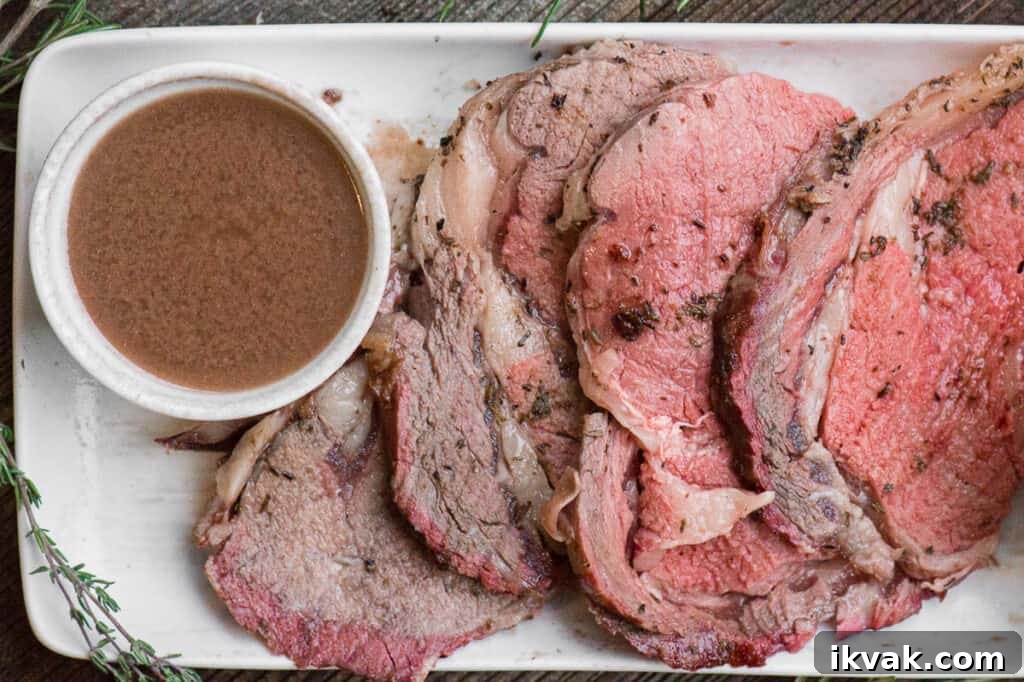 Classic Au Jus Recipe for Tender Roast Beef and Dipping Sauce 5 thinly sliced pieces of smoked prime rib next to homemade au jus.