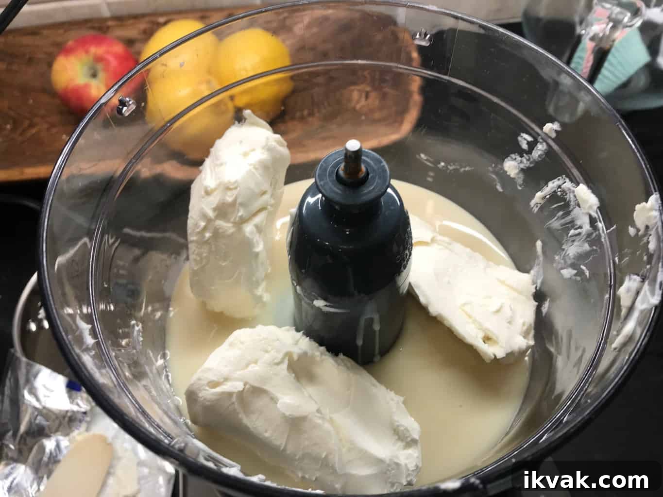 No-Bake Lemon Icebox Pie Recipe: Bright, Creamy Summer Dessert 3 Food processor with condensed milk and cream cheese in it.
