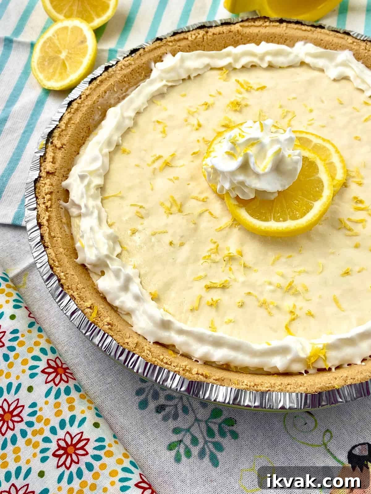 No-Bake Lemon Icebox Pie Recipe: Bright, Creamy Summer Dessert 4 No Bake Lemon Icebox pie on floral tablecloth.