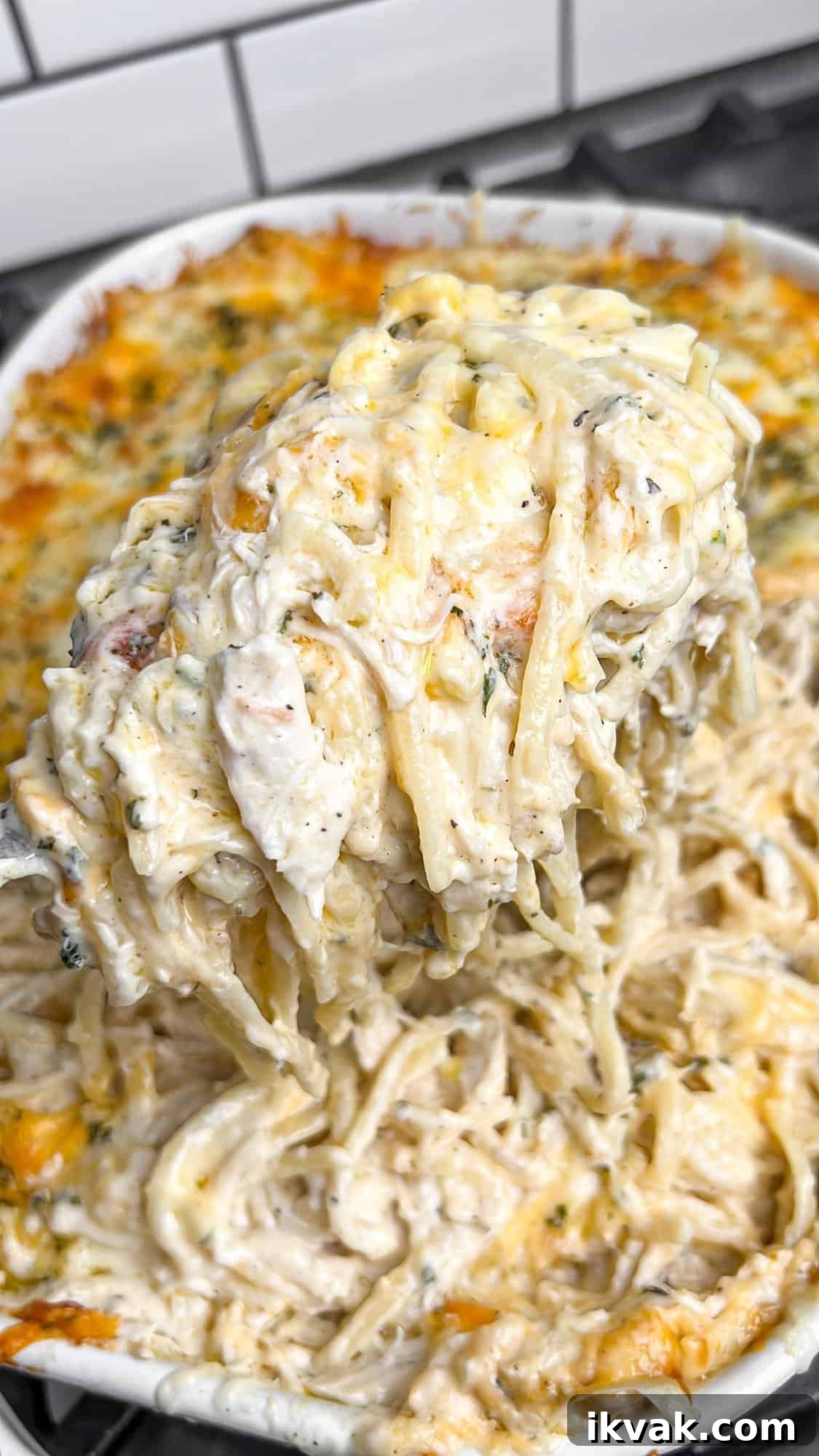 Lusciously creamy, cheesy, and garlicky, this easy chicken tetrazzini can be whipped up in under an hour for an easy weeknight dinner. Serving a scoop of chicken tetrazzini
