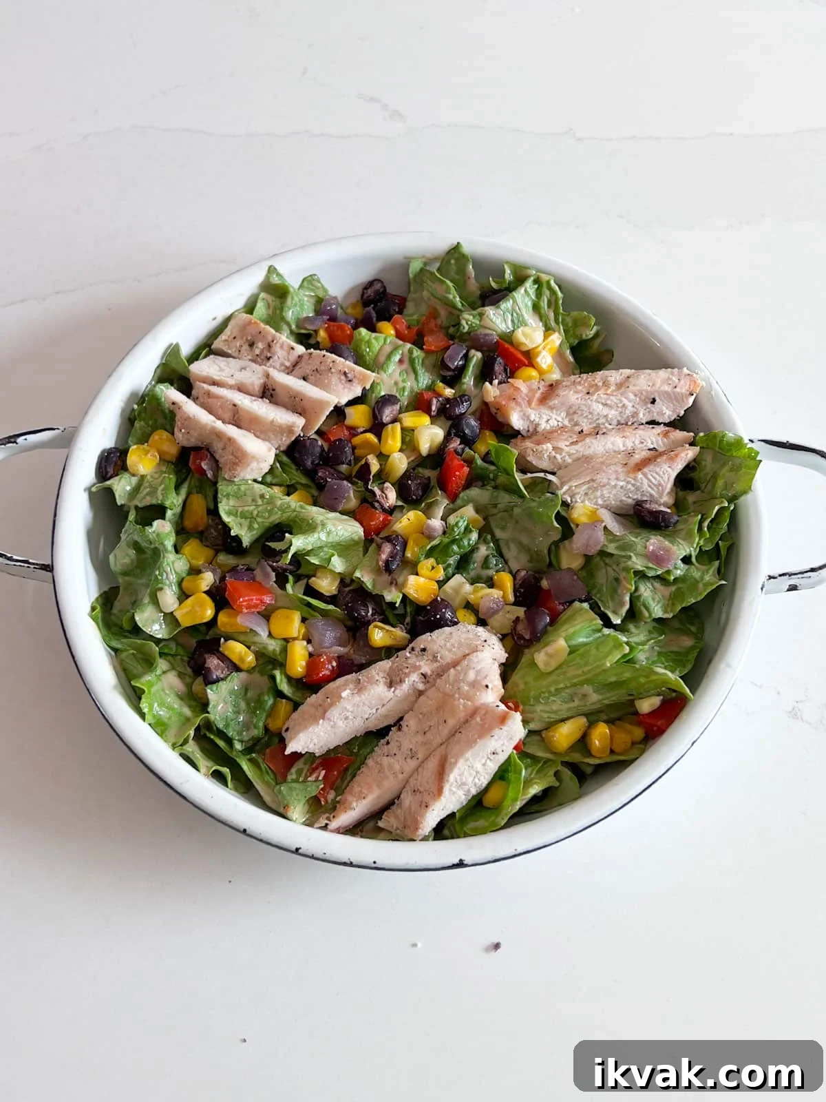 Chicken added on top of the salad.
