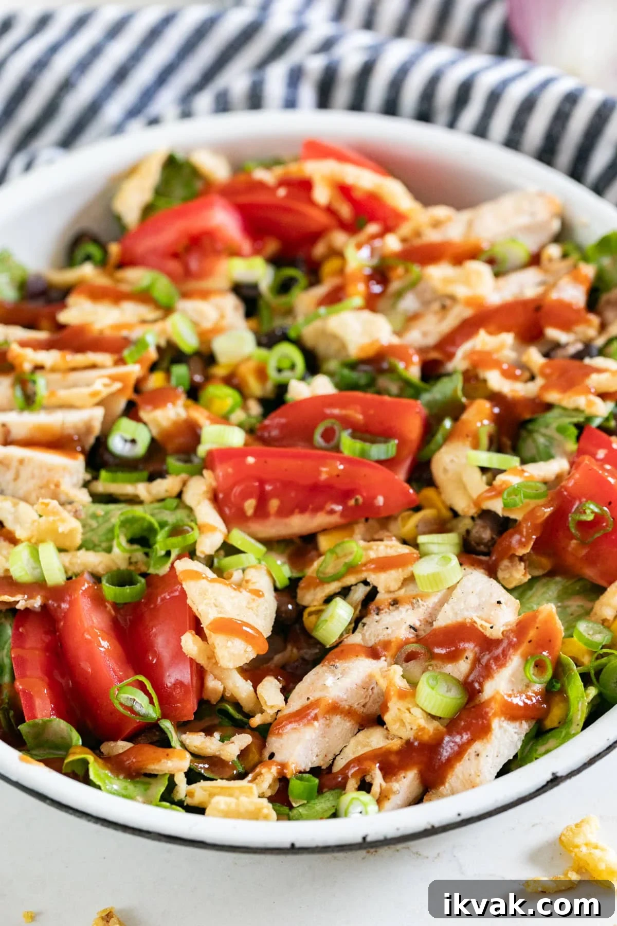 A close up image of a BBQ salad with chicken.