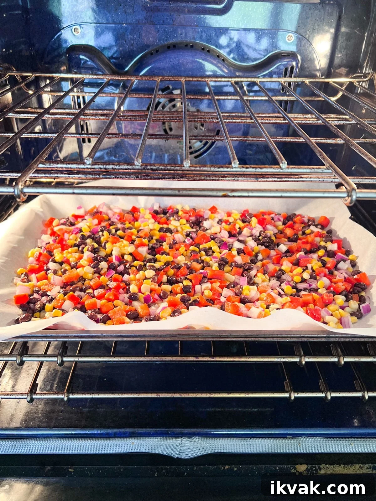 Pan of corn salsa going into the oven.