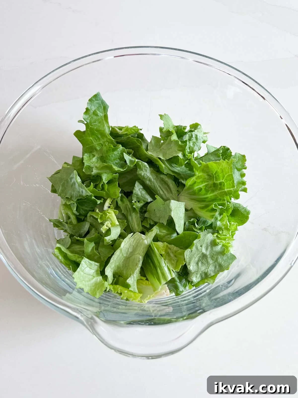 Lettuce in a glass bowl.