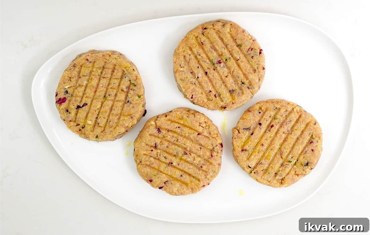 Four turkey patties on a platter