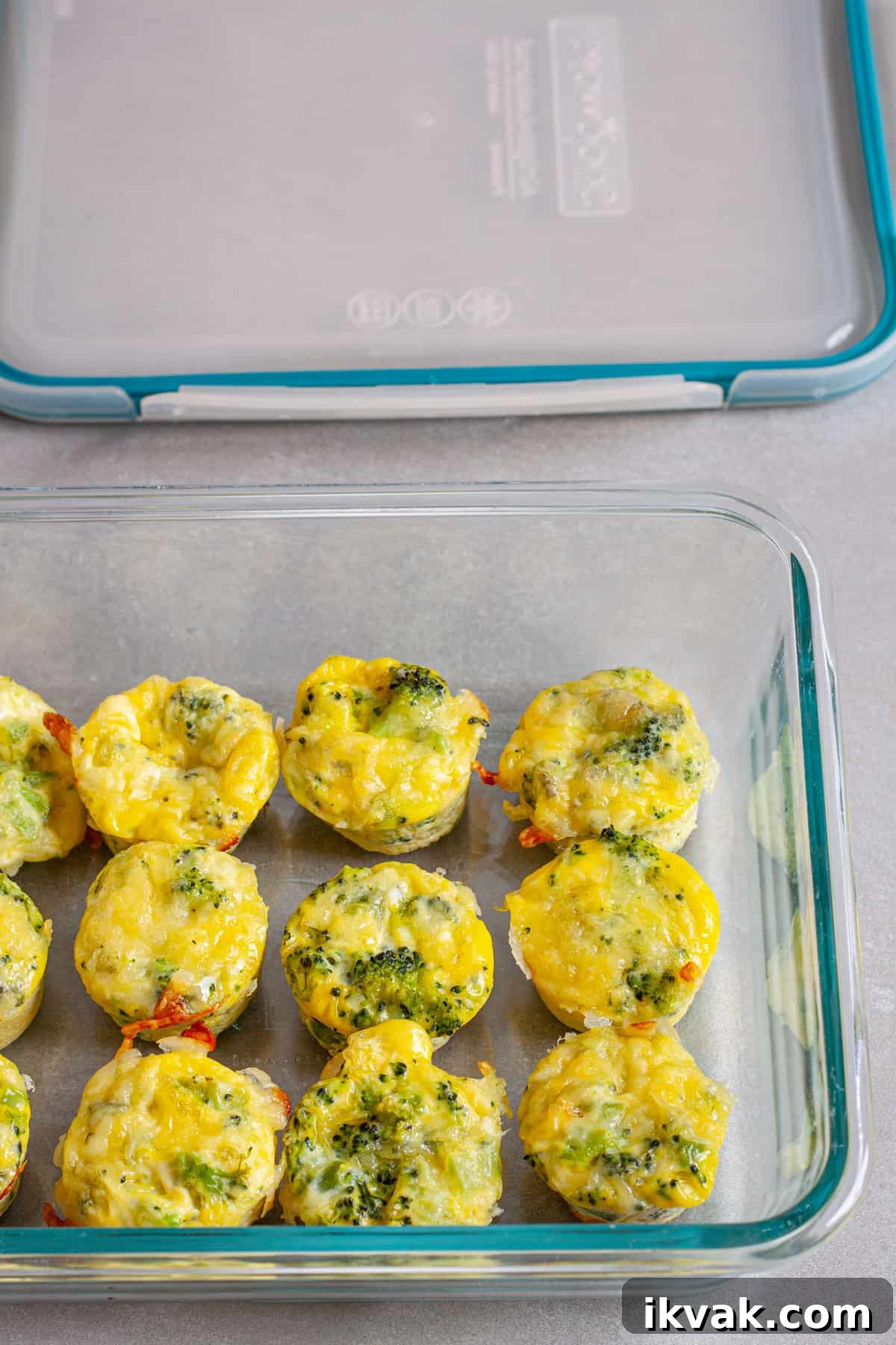 A glass storage container with min egg bites for meal prep.