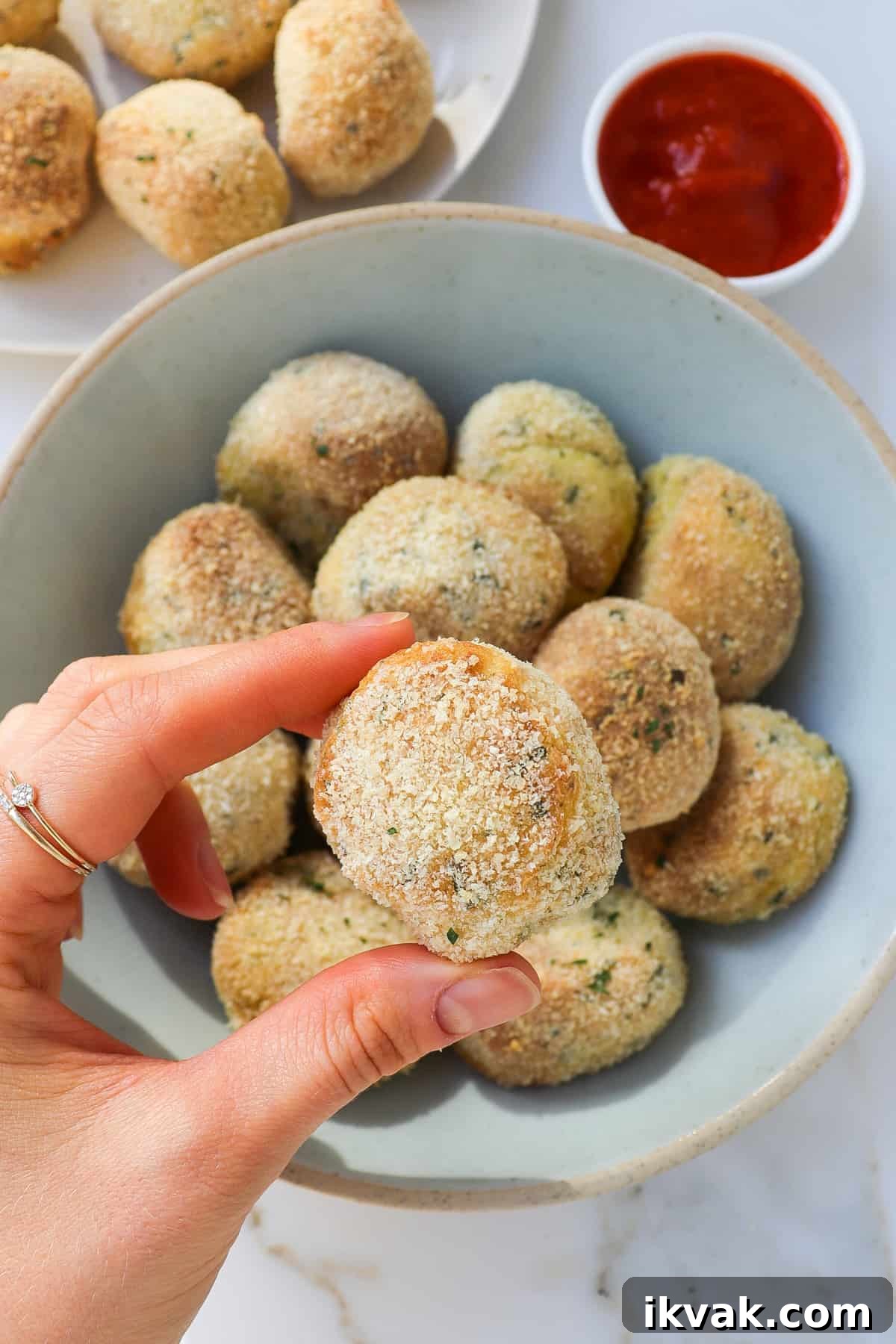 Crispy Air Fryer Potato Croquettes Recipe 3 Holding a potato croquette in my hand.