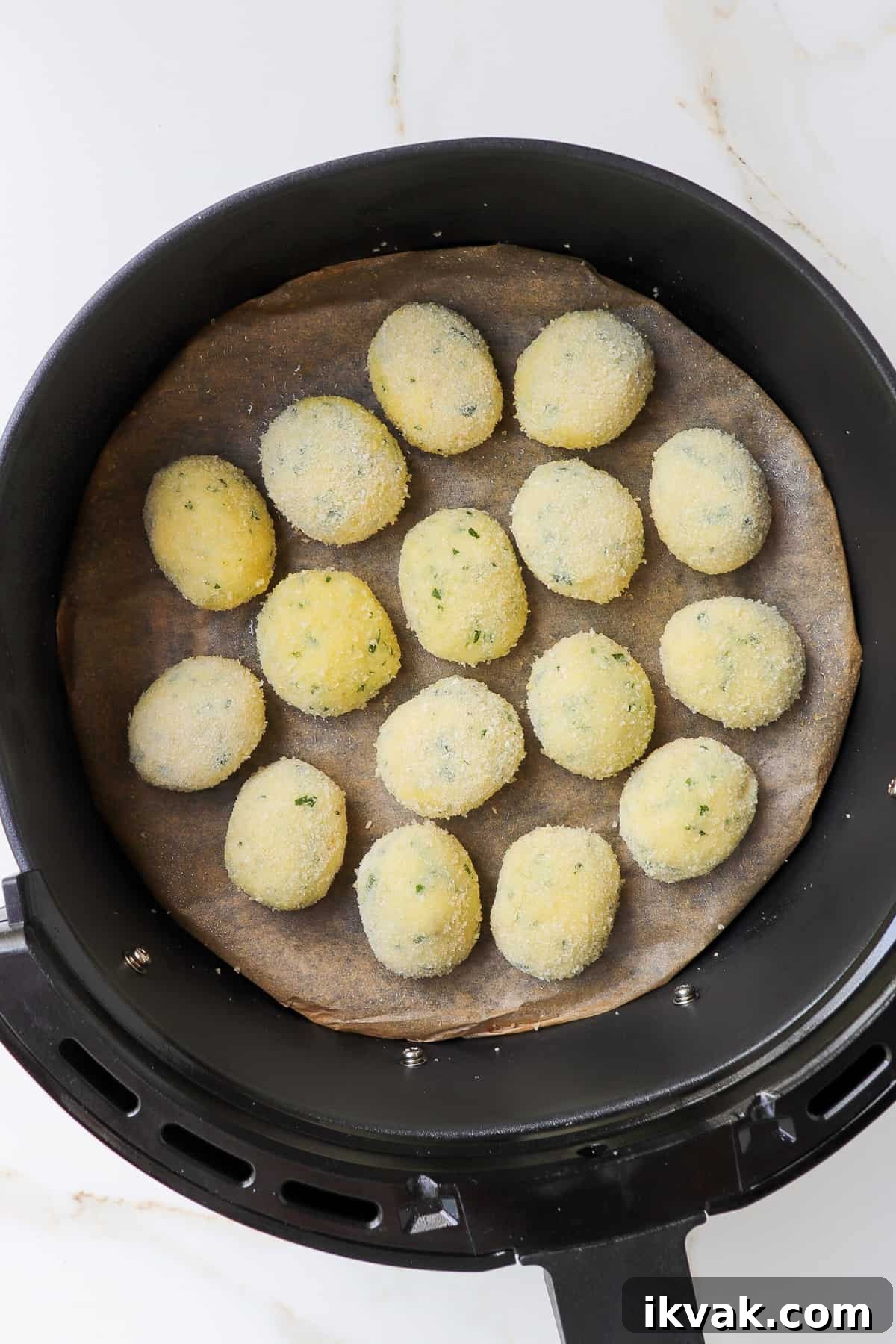 Crispy Air Fryer Potato Croquettes Recipe 8 Potato croquettes in the air fryer basket.