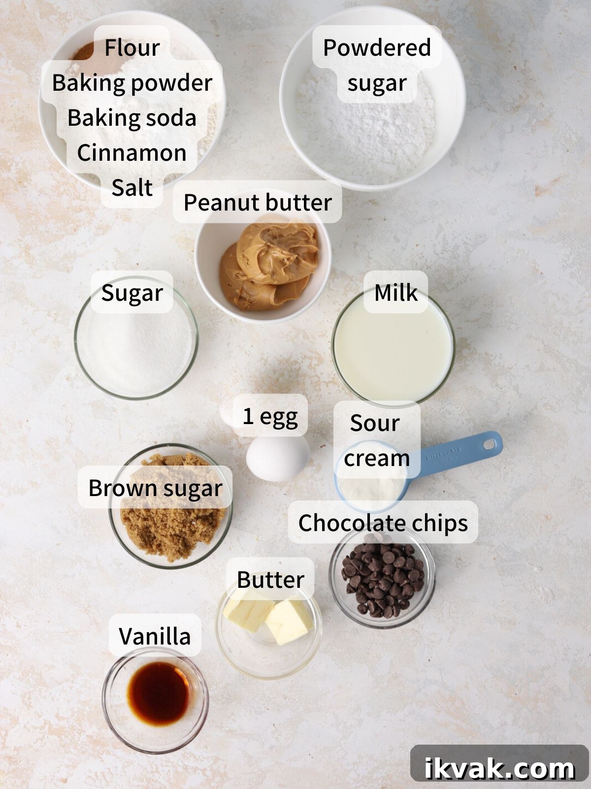Irresistible Peanut Butter Donuts Recipe — Soft, Gooey, Homemade 3 Labeled ingredients needed to make peanut butter donuts laid out on a table.