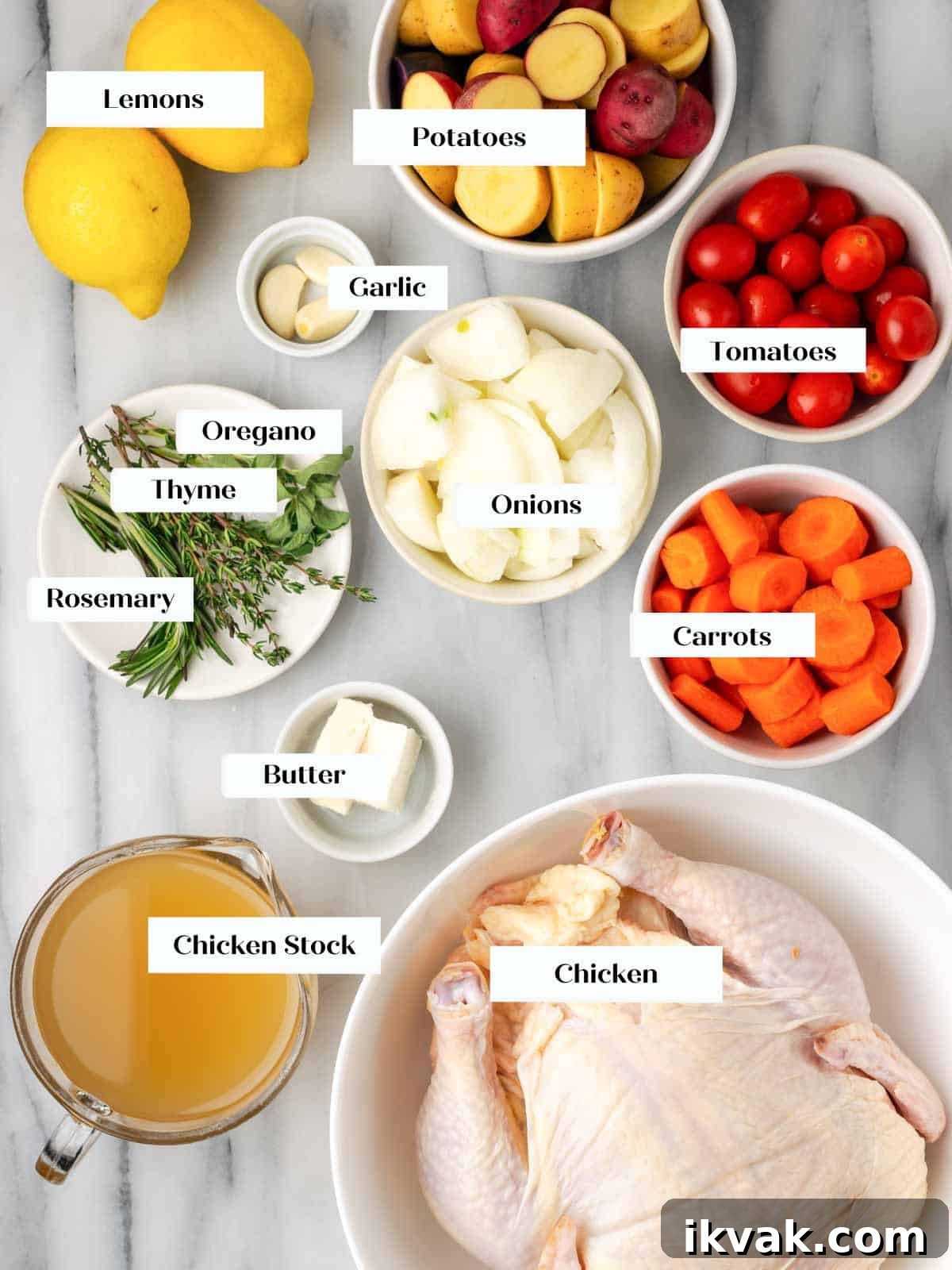 ingredients for roasted lemon chicken on marble.