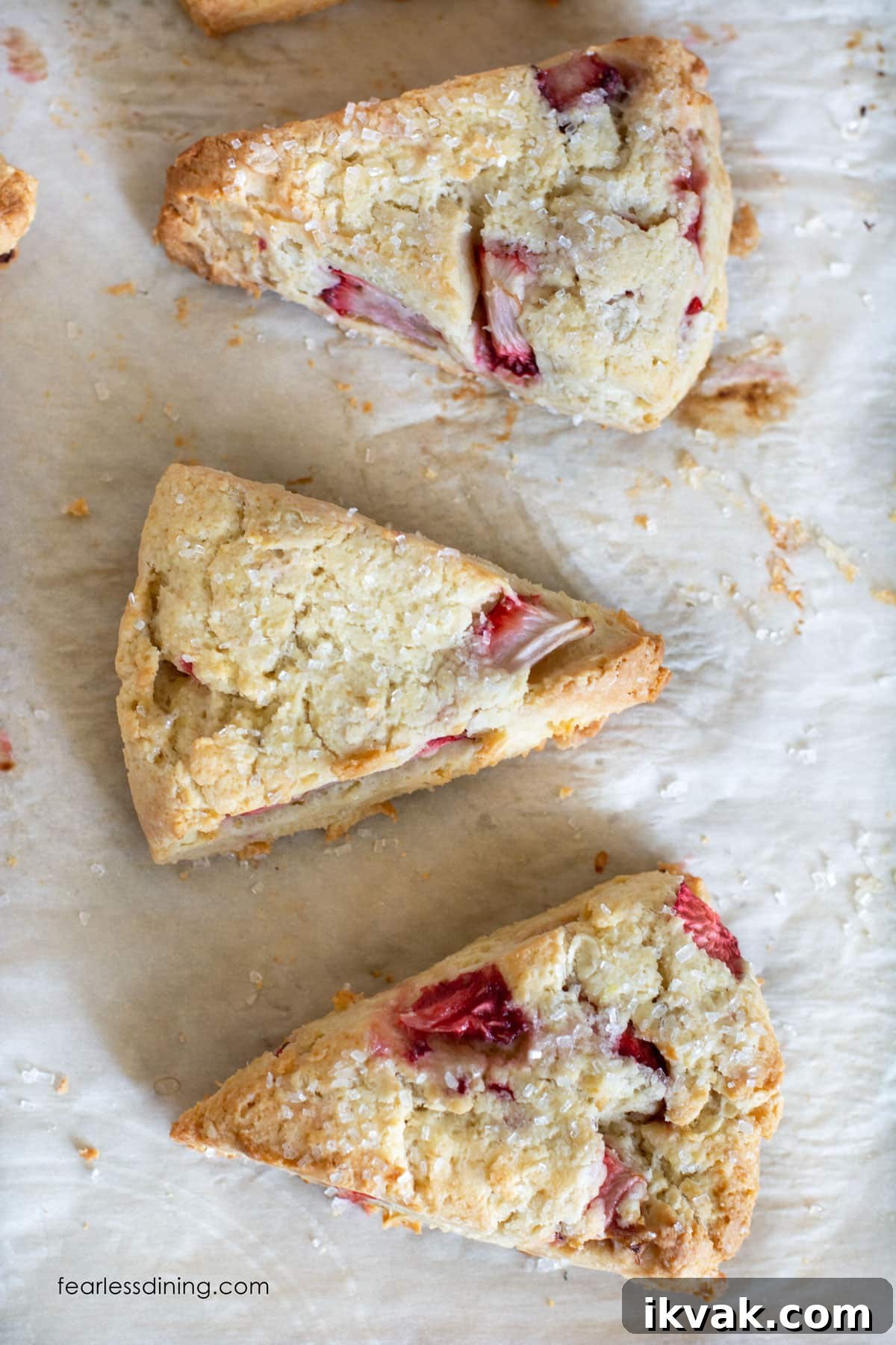 Gluten-Free Strawberries & Cream Scones Recipe for Brunch 7 The top view of gluten free strawberry scones on a baking sheet.