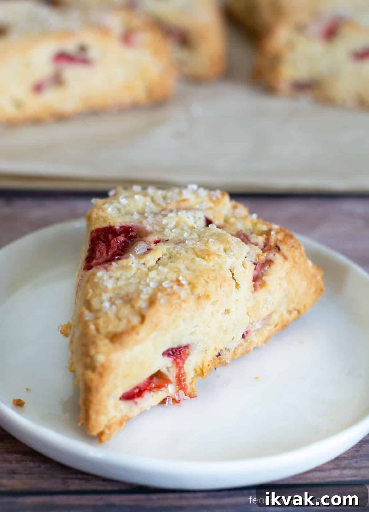Gluten-Free Strawberries & Cream Scones Recipe for Brunch 8 A single scone on a small white plate.