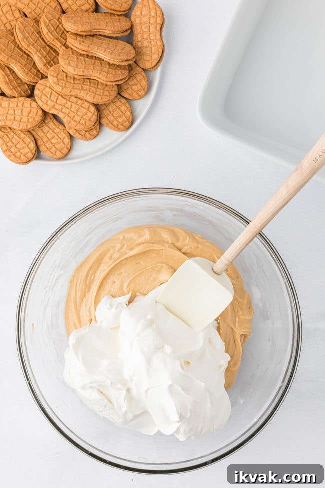 peanut butter fluff with cool whip in a glass bow step 3