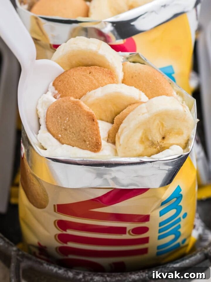 close up picture of a walking banana pudding - a bag of vanilla wafers that has been filled with bananas, cream and pudding