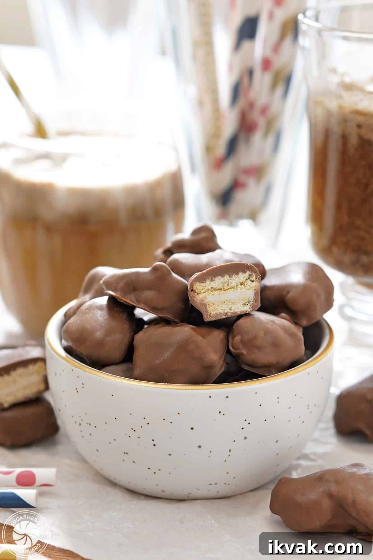 White bowl of Homemade Root Beer Float Pieces, with one cut open on top.