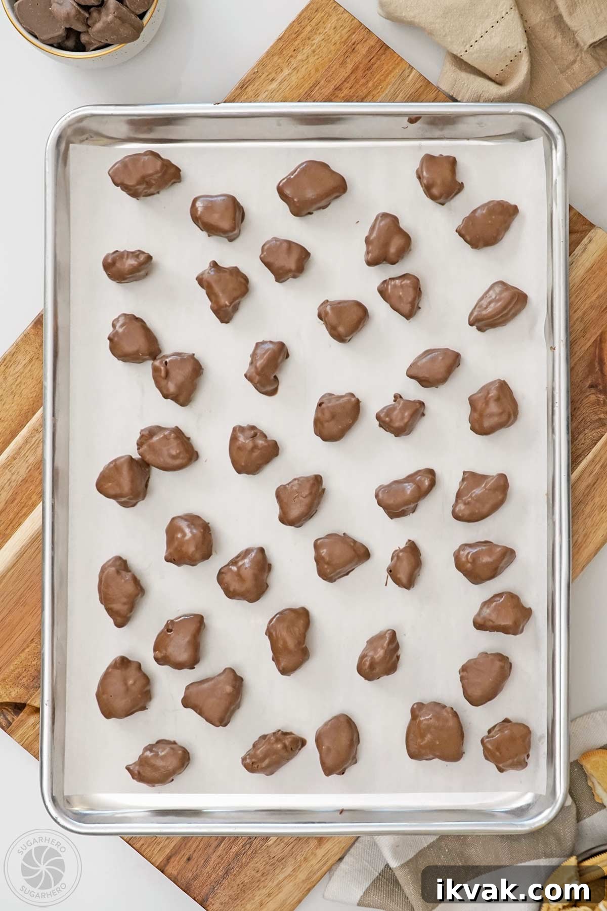 Dipped Root Beer Float Pieces on a baking sheet covered with parchment.