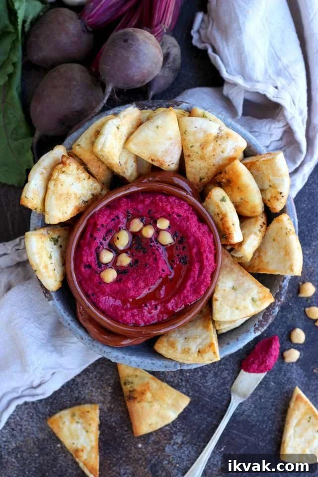Roasted Beet Hummus in a Bowl with Pita Chips