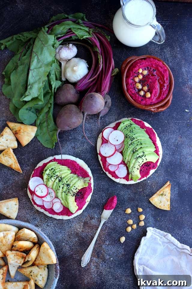 Hummus on Pita Bread Topped with Avocado and Radishes