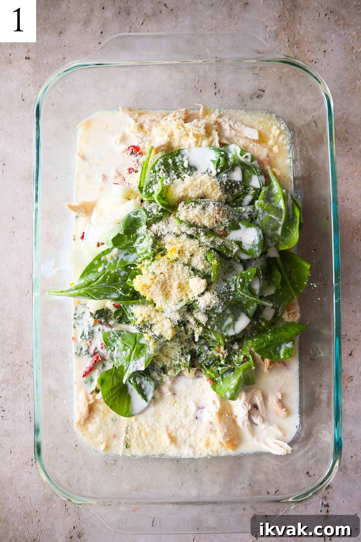 orzo, chicken, cheese, spinach half and half, and broth dumped into glass baking dish.