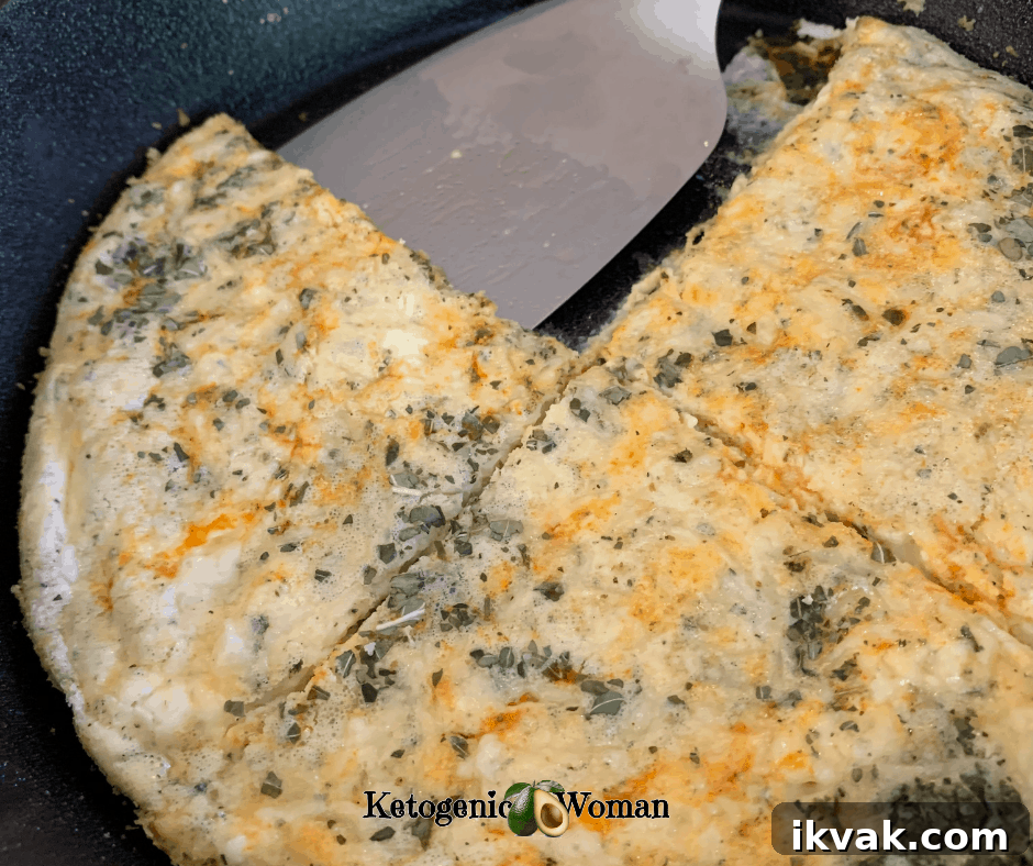 Low-Carb Skillet Cheese Pizza Recipe (Keto & Egg Fast Friendly) 2 Ketp Pizza in pan cut into 4 pieces