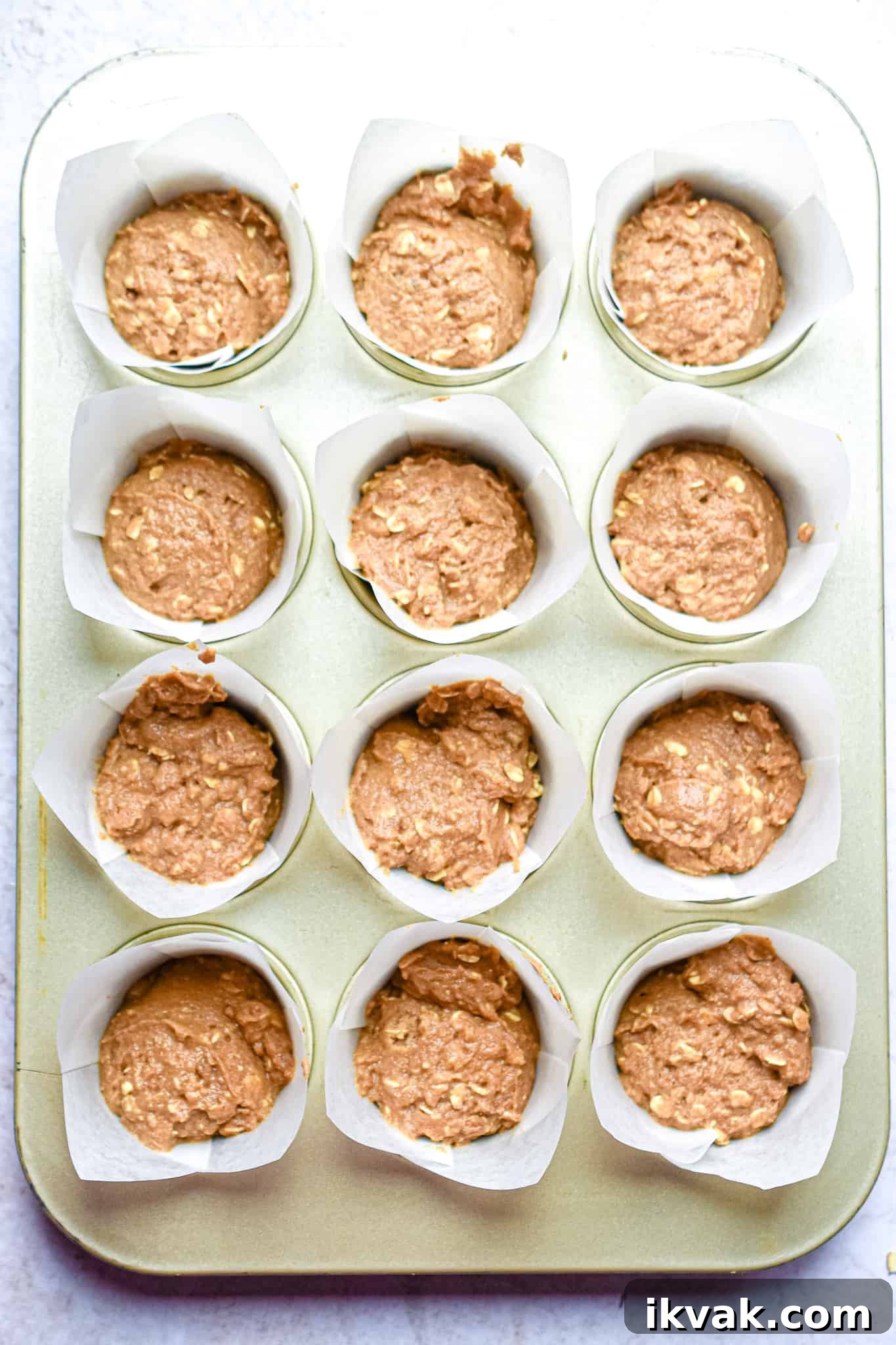 Pumpkin Oatmeal Muffins with Warm Spices and Maple Glaze 12 The batter is scooped into the muffin tin