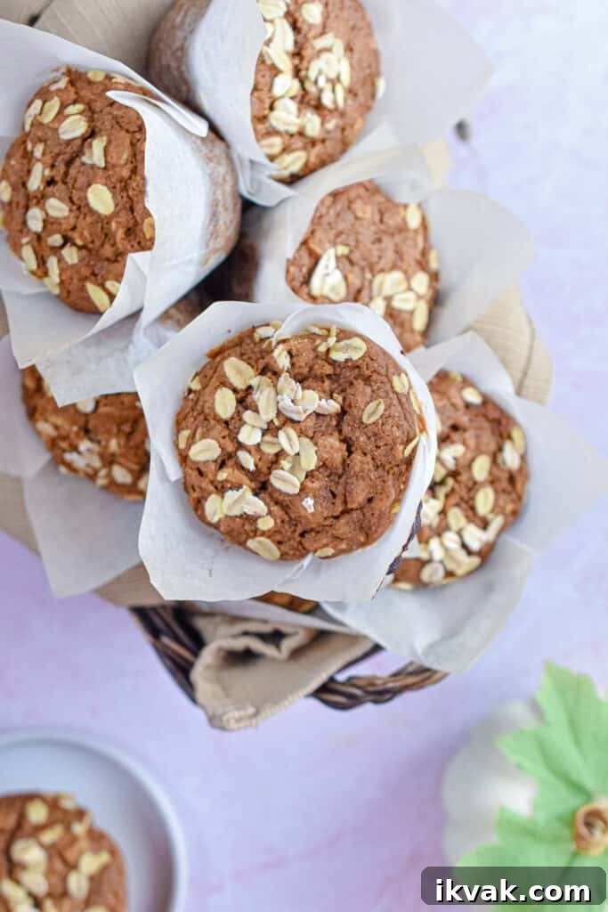 Pumpkin Oatmeal Muffins with Warm Spices and Maple Glaze 13 The muffins are in a basket.