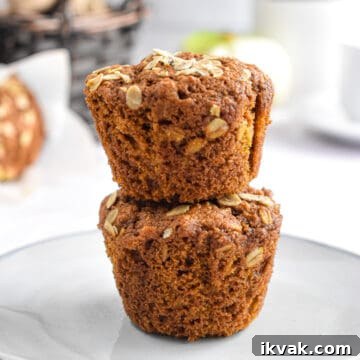 Pumpkin Oatmeal Muffins with Warm Spices and Maple Glaze 16 Two muffins are stacked on top of each other.