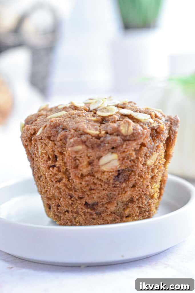 Pumpkin Oatmeal Muffins with Warm Spices and Maple Glaze 5 A close up of a pumpkin oatmeal muffin
