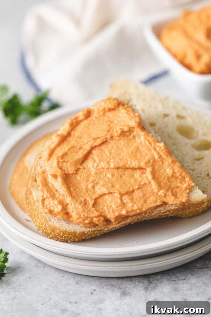 Cream cheese spread onto a piece of bread.