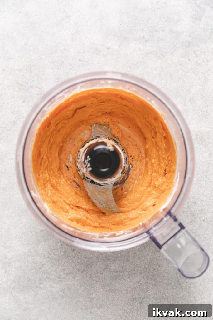 Flavored cream cheese in a food processor.