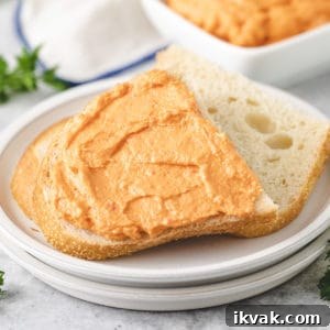 Close up view of garlic and sun dried tomato cream cheese on bread.