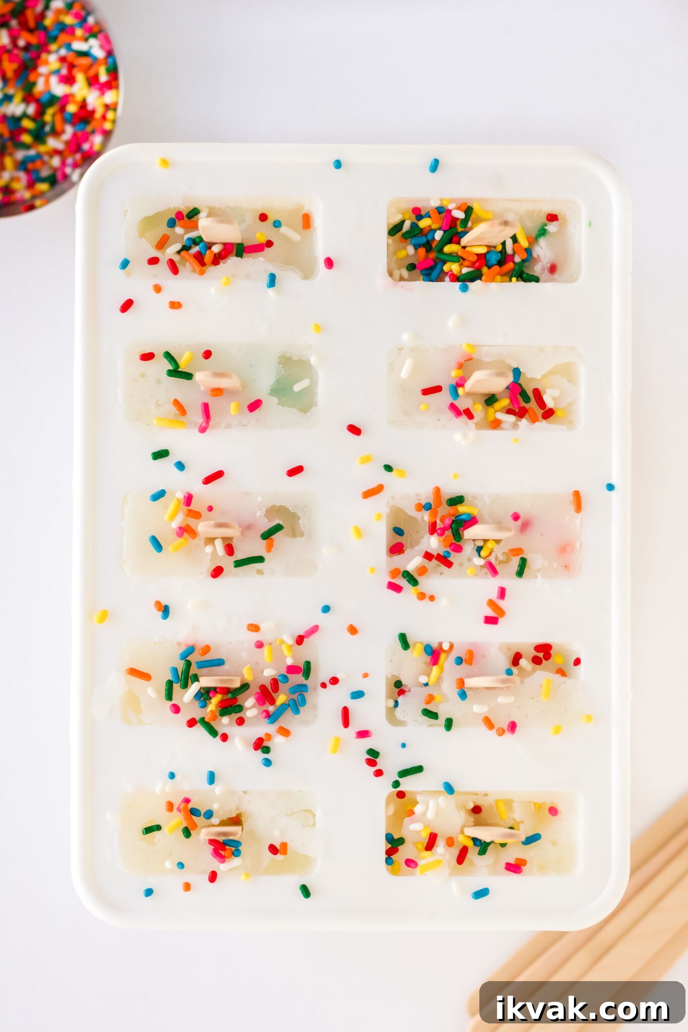 Funfetti Cake Batter Popsicles Recipe: Homemade Party Treat 6 cake mix popsicles being made