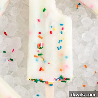 Funfetti Cake Batter Popsicles Recipe: Homemade Party Treat 8 Cake Batter Popsicles on a bunch of ice cubes