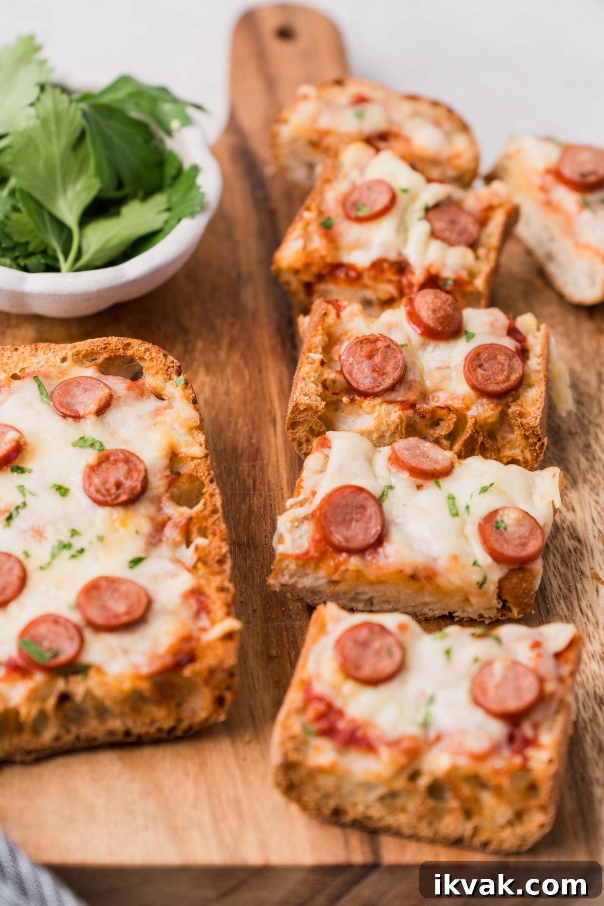 french bread pizza in air fryer cut into pieces.
