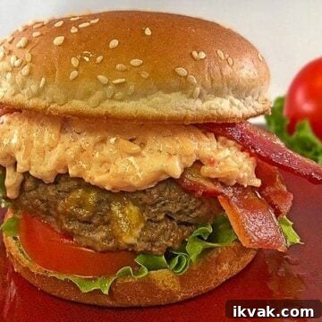 hamburger patty stuffed with cheese on a bun