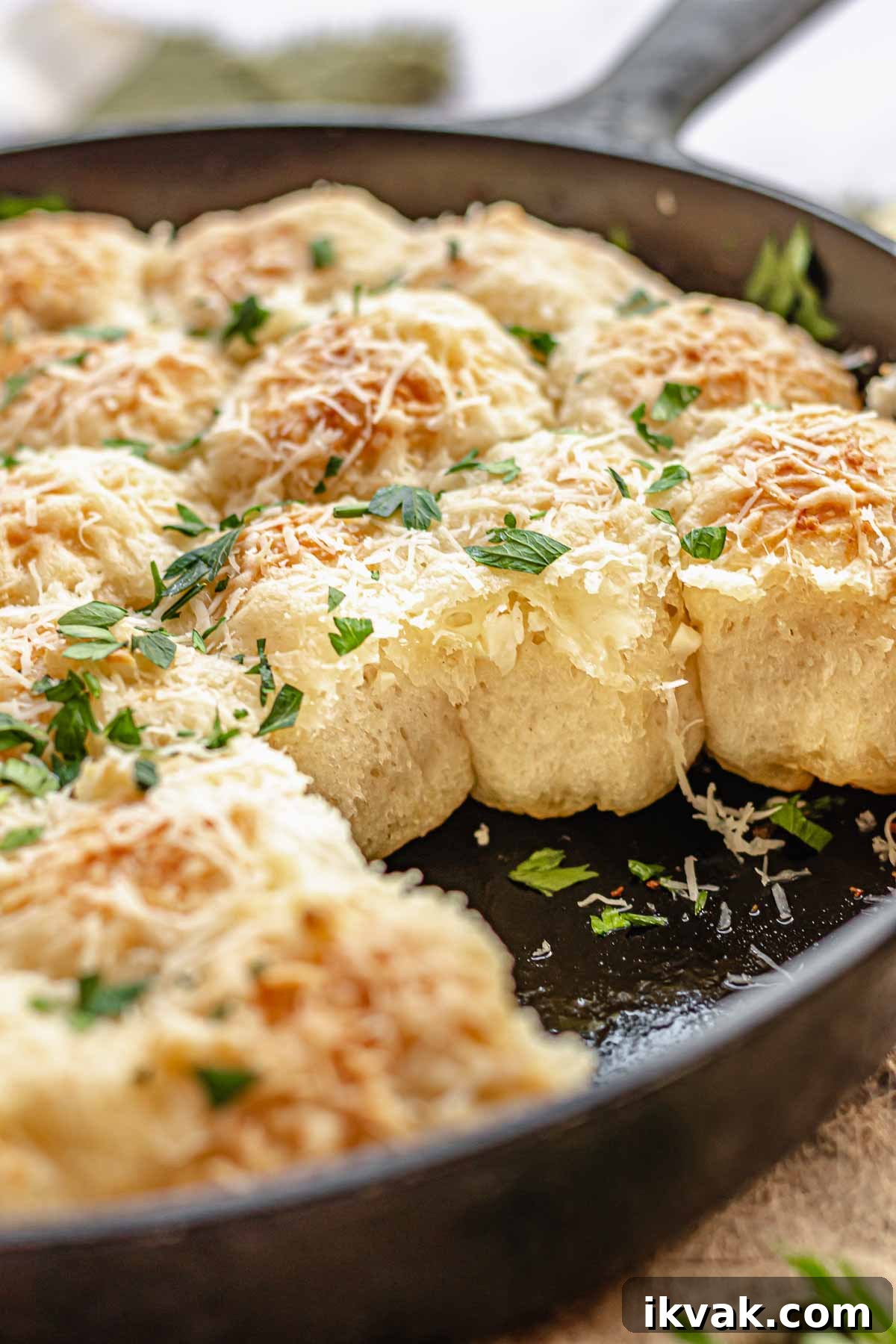 Bread bites in a pan. Some are removed so you can see the fluffy sides.