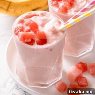 two banana watermelon smoothies on white plate