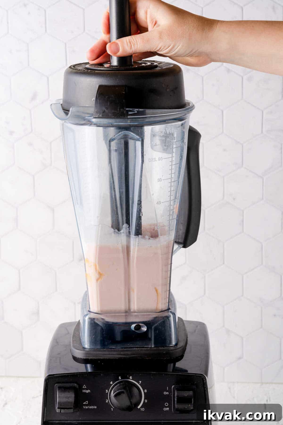 Creamy Banana and Watermelon Smoothie Recipe 7 banana watermelon smoothie being blended with help of tamper tool